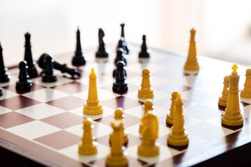 view of a chess board with play strategy, the king is down.
