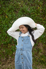 latin little girl in a hat