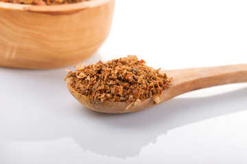 Ras el hanout moroccan spice. Ras el hanout in wooden bowl, on white background. Moroccan spice