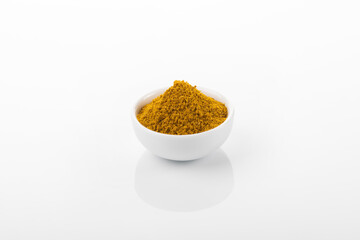 Ras el hanout moroccan spice powder. Ras el hanout in white bowl, on white background. Moroccan spice