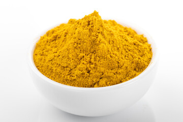 Curry powder. Curry powder in white bowl, on white background. Curry
