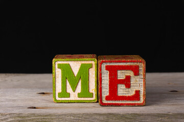 Me spelled in vintage blocks.