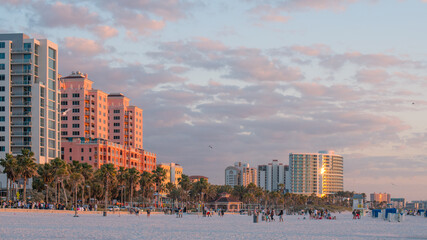 Island Clearwater Beach FL. Ocean or Gulf of Mexico shore. Spring break or Summer vacations in Florida. Hotels, restaurants and Resorts. Tropical Nature with palm trees. United States of America.