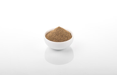 Black pepper. Black pepper in white bowl, on white background. Black pepper powder.