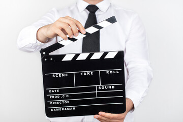 Close up Of A Businessman Holding Clapperboard Over White Background