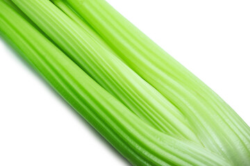 Close-up of celery stalks on white background. Fresh green vegetables. Diet concept.