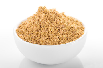 Ginger powder. Ginger powder in white bowl, on white background. Ginger, ginger powder.