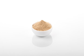 Cardamom powder. Cardamom powder in white bowl, on white background. Cardamom, Cardamom powder