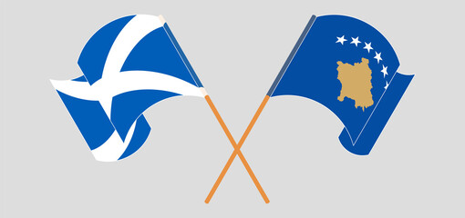 Crossed and waving flags of Scotland and Kosovo