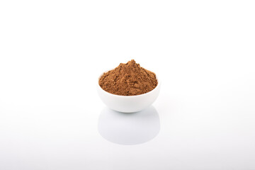 Cinnamon, cinnamon powder. Cinnamon powder in white bowl, on white background. 