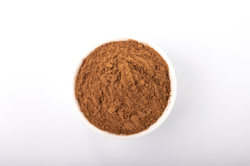 Cinnamon, cinnamon powder. Cinnamon powder in white bowl, on white background. 