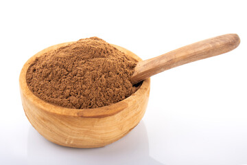 Cinnamon, cinnamon powder. Cinnamon powder in wooden bowl, on white background. 