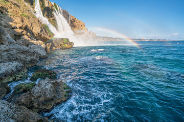 Fototapeta na wymiar The scenic view of Düden waterfall and rainbow on a sunny day from different sea levels in Antalya