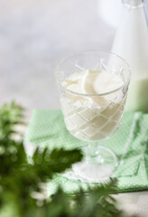 Fermented drink kefir, yogurt in a glass jar on a light background. Probiotic cold fermented dairy drink. Healthy gut flora concept.