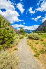 Beautiful landscape of valley in Alpine mountains, small trail, hike root, majestic picturesque view in sunny day. Lillooet Setaon Lake. Vancouver. British Columbia. Canada.