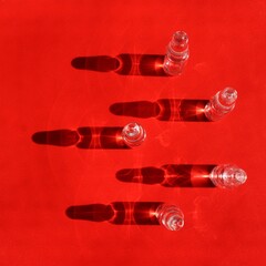 phials on a red background
