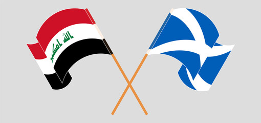 Crossed and waving flags of Iraq and Scotland