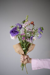 person holding a bouquet of flowers