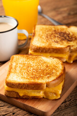 Grilled ham and cheese. Sandwich with cheese and ham on grill.