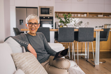 Portrait of a modern senior woman relaxing at home.