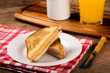 Grilled ham and cheese. Sandwich with cheese and ham on grill.
