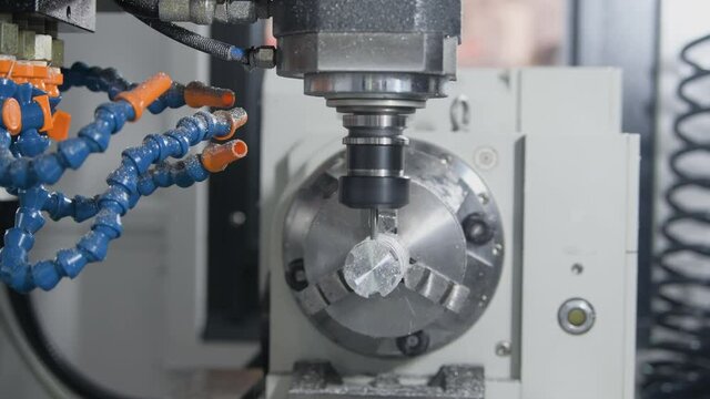 milling cnc machining. cutting tool processing metal detail on milling machine in workshop