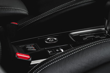 Seat heating and Super All Wheel controller buttons close up view. Car interior. Four-wheel drive...