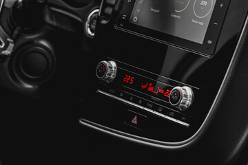 Color car air conditioning buttons close up view inside a car. Car temperature conditioner dashboard panel.