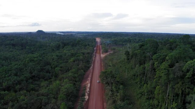 DRONE DJI MAVIC 2 IMAGE LANDSCAPE WHITE CAR ON THE ROAD IN THE MIDDLE OF AMAZON AMAZON FOREST BRAZIL