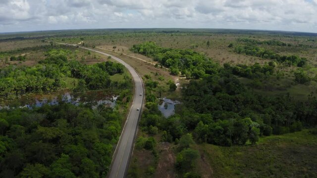 DRONE DJI MAVIC 2 IMAGE LANDSCAPE WHITE CAR ON THE ROAD IN THE MIDDLE OF AMAZON AMAZON FOREST BRAZIL