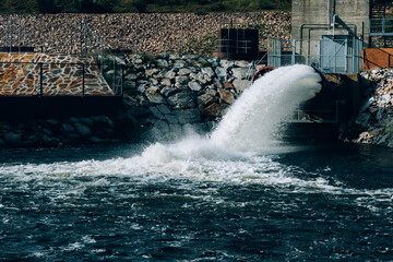 Water discharge on a sunny day - obrazy, fototapety, plakaty