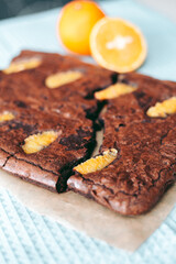 Freshly baked aromatic chocolate brownie with orange