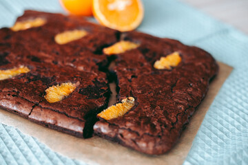 Freshly baked aromatic chocolate brownie with orange