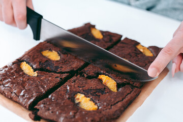 Freshly baked aromatic chocolate brownie with orange