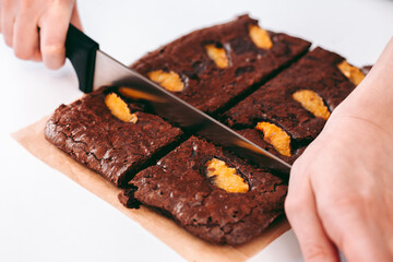 Freshly baked aromatic chocolate brownie with orange