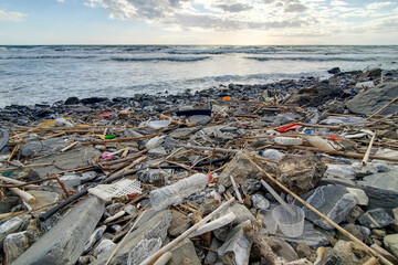 Dump of plastic garbage pollution on contaminated sea coast ecosystem,environmental waste 