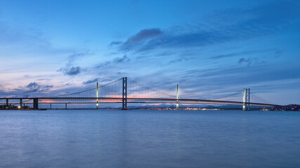 Two bridges against the sunset sky, Forth Road Bridge and Queensferry Crossing, Scotland, United Kingdom