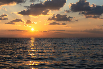 Sunset on the sea with a sunny path. Beautiful sunset in Cyprus.