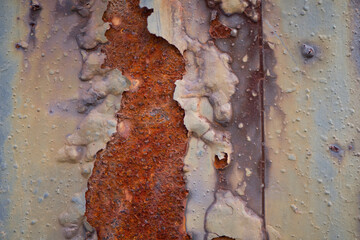 Rusty metal wall background with streaks of rust. Rust stains. Rust texture.