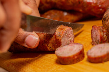 cutting sausage