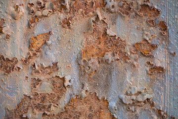  Rusty metal wall background with streaks of rust. Rust stains. Rust texture.