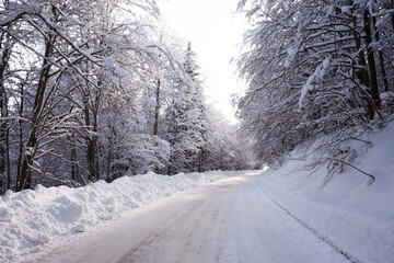 Winter landscape, road covered by snow