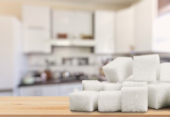 Cubes of white sweet sugar on the desk