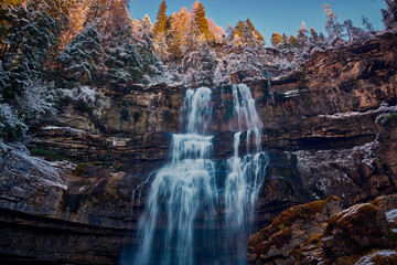 Beautiful Waterfall Vallesinella in Madonna di Campiglio in the autumn time, National Park...