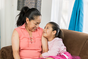 mother and daughter hugging and smiling