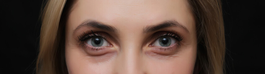 Female eye with long eyelashes close up