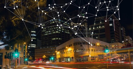 Composition of net of connections over a cityscape in background