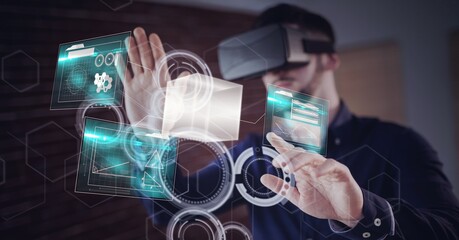 Composition of caucasian man using vr headset touching shapes and data background