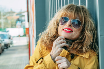 portrait of mature or senior adult woman on the street