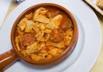 Spanish dish Callos stewed beef tripe and chorizo served in clay bowl